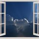 Looking at a dramatic sky through open window frames